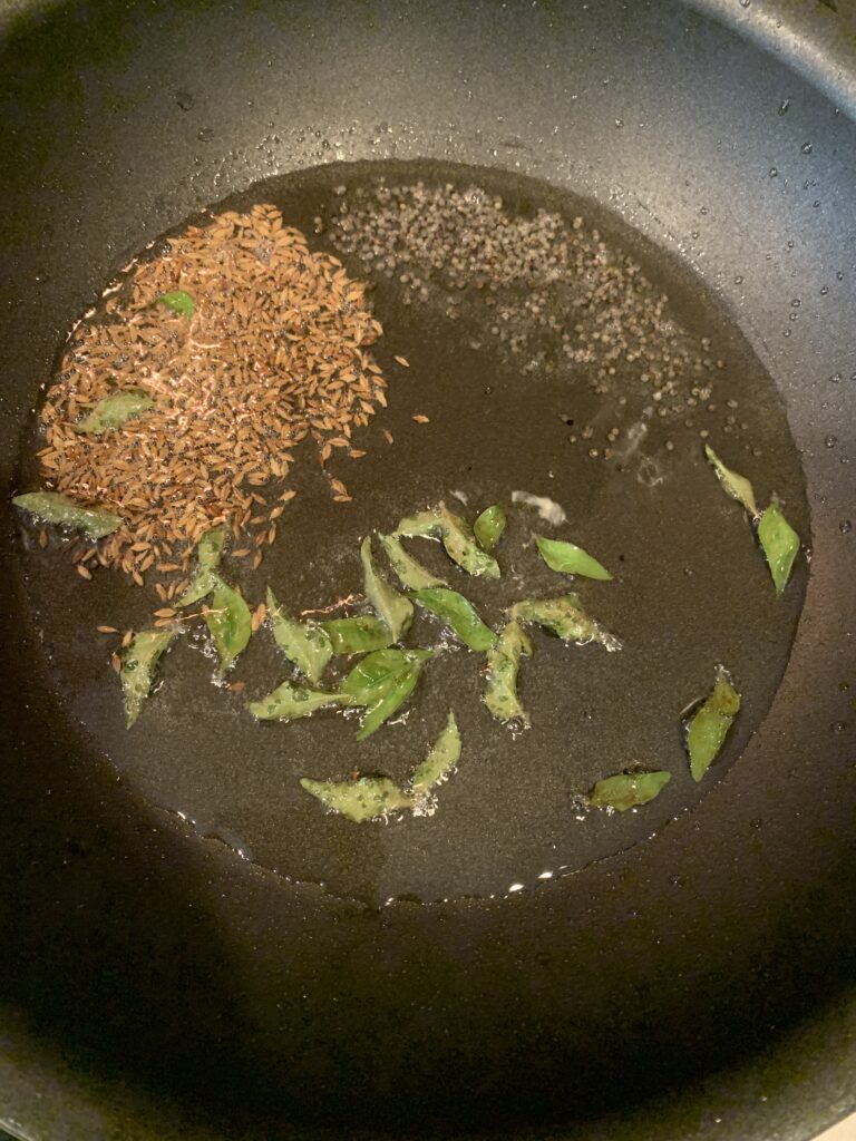 Add mustard seeds, cumin seeds and curry leaves
