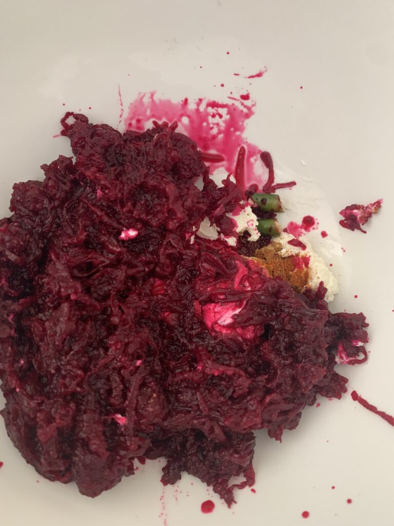 add grated beetroot, green chilies, roasted cumin powder and salt