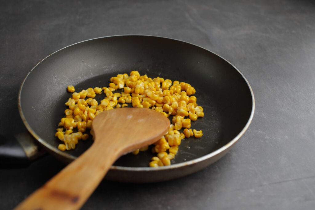 Sweet corn kernels on pan