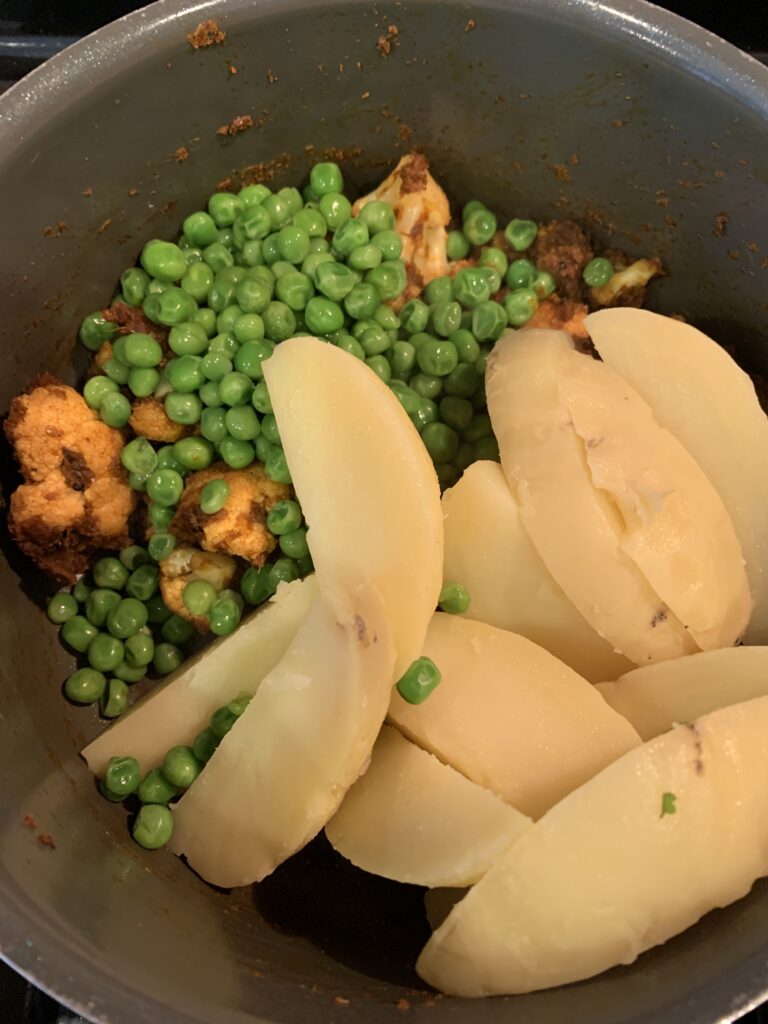 add peas and potatoes